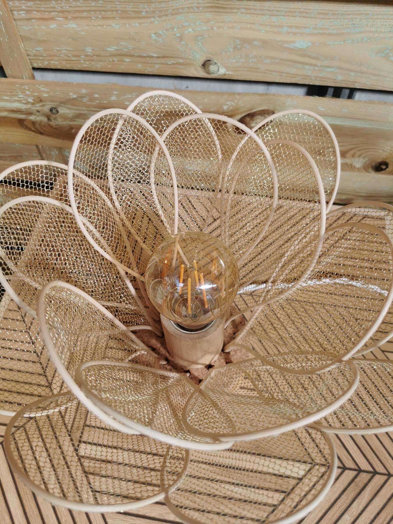 Flower table lamp made of rattan petals and gold mesh