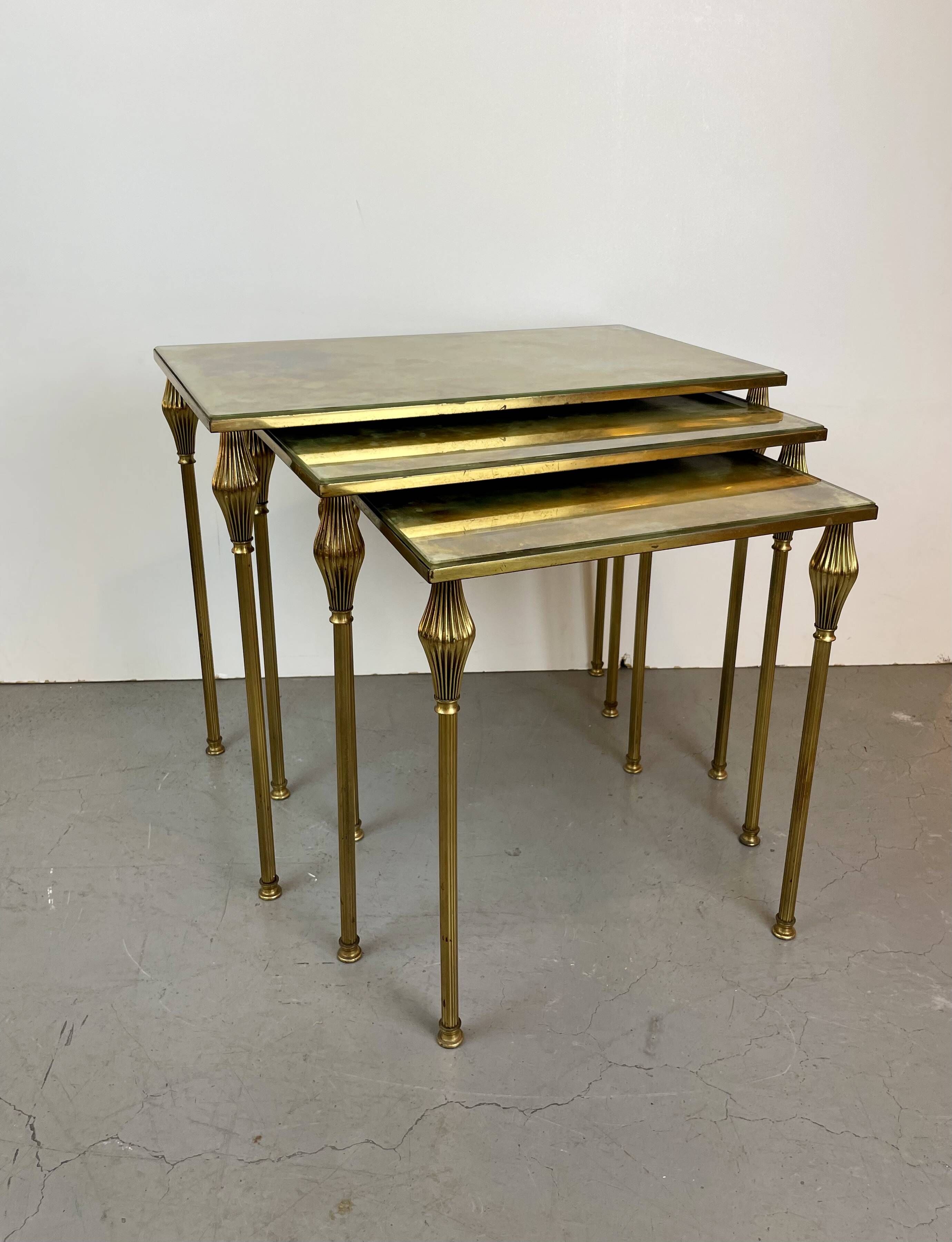 Nested brass tables, attributed to Maison Baguès, France, 1950–60.