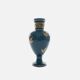Small turquoise blue and gold porcelain vase with elegant floral patterns.