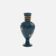 Small turquoise blue and gold porcelain vase with elegant floral patterns.