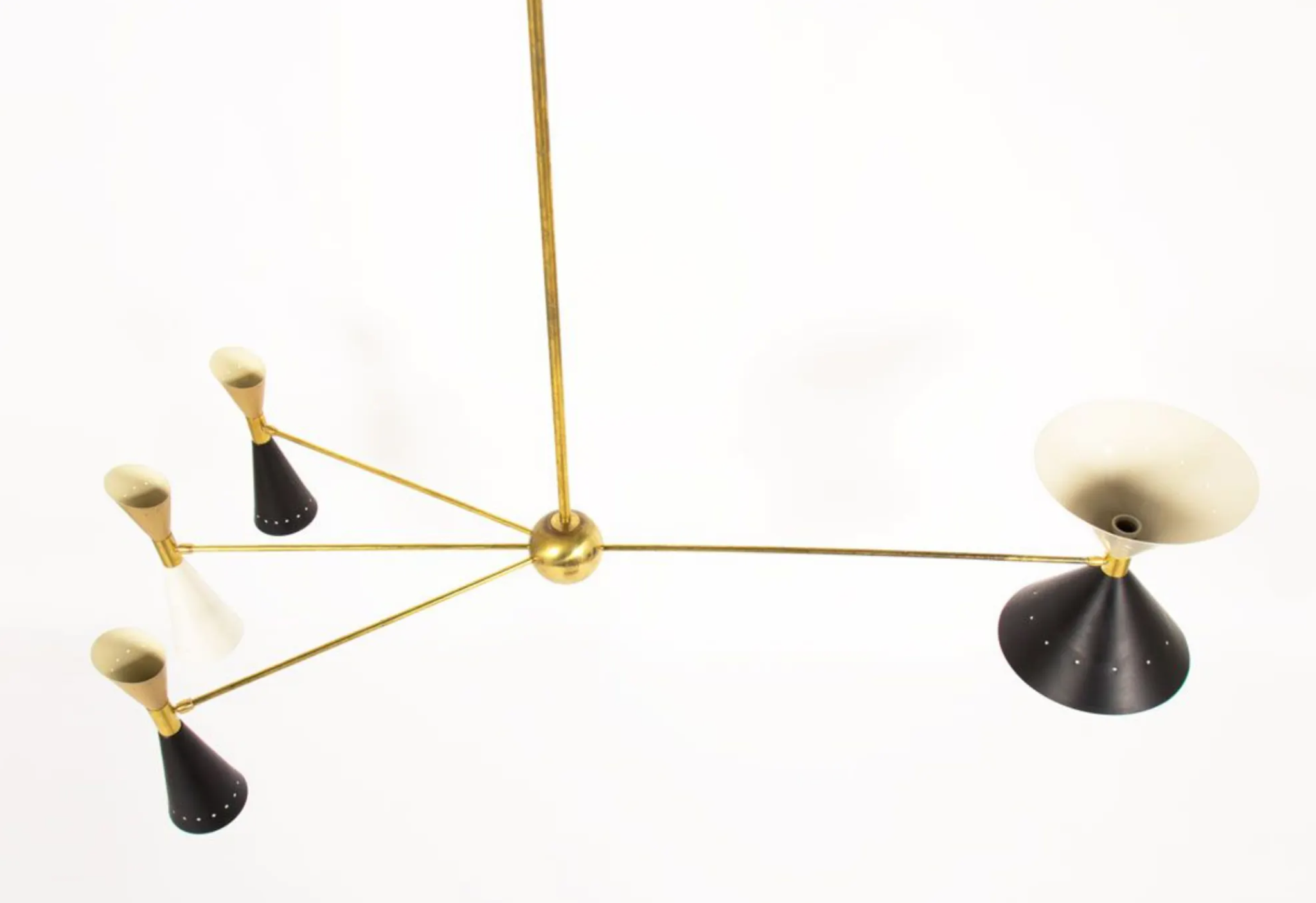 8-light brass chandelier and white-black and gold day blinds