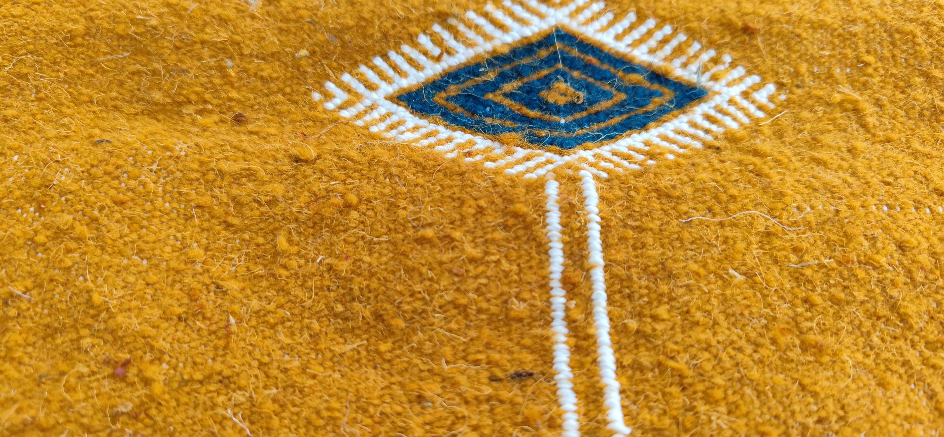 Mustard yellow kilim carpet with multicolored berber patterns