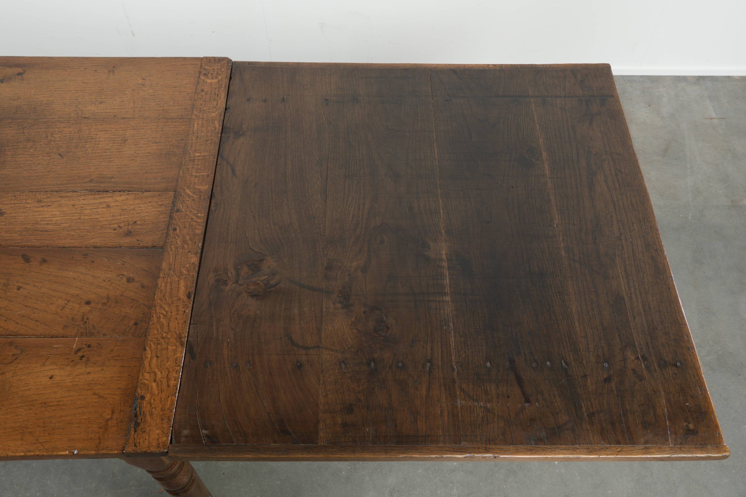 Antique oak dining table from the late 18th century with extendable leaves
