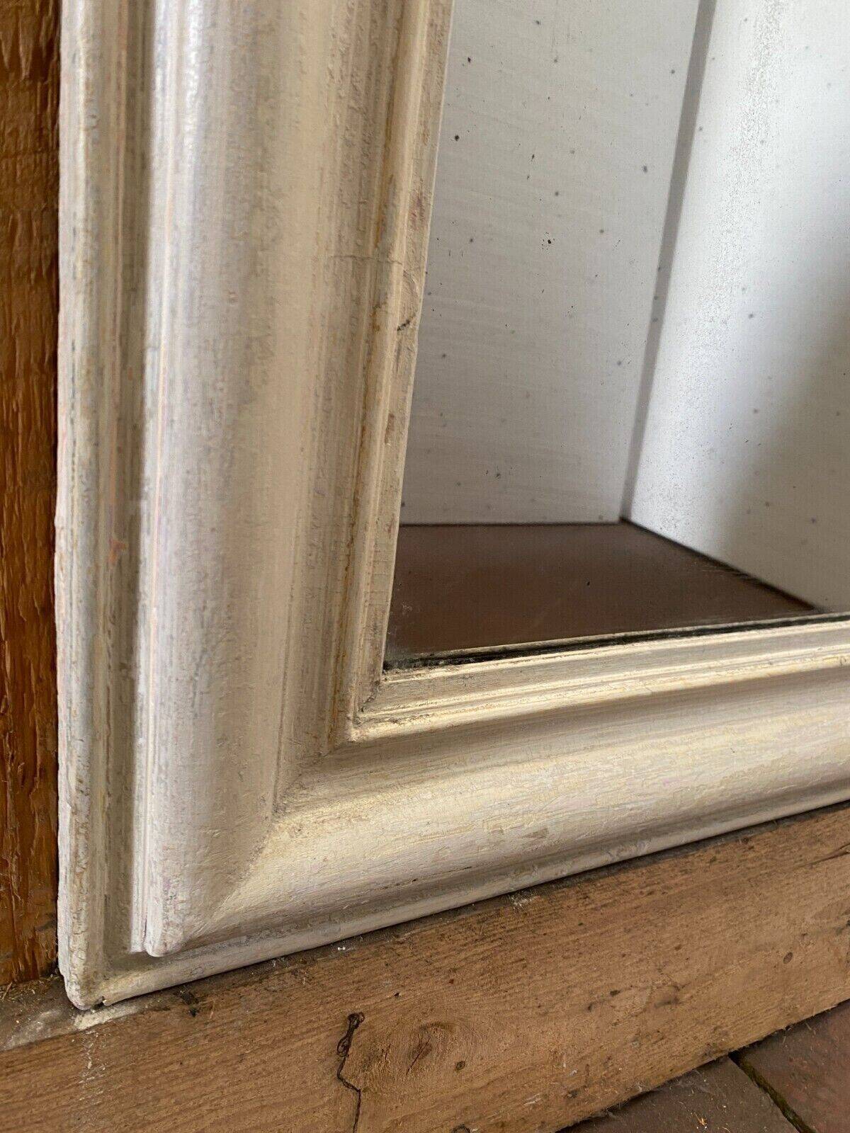 Louis Philippe mirror in wood and patinated stucco 19th century