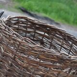 Brown woven vintage Hungarian wicker basket, reinforced edge and metal handles, 1940s.