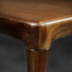 Classic vintage mid-century Scandinavian rosewood coffee table with a sliding black top.
