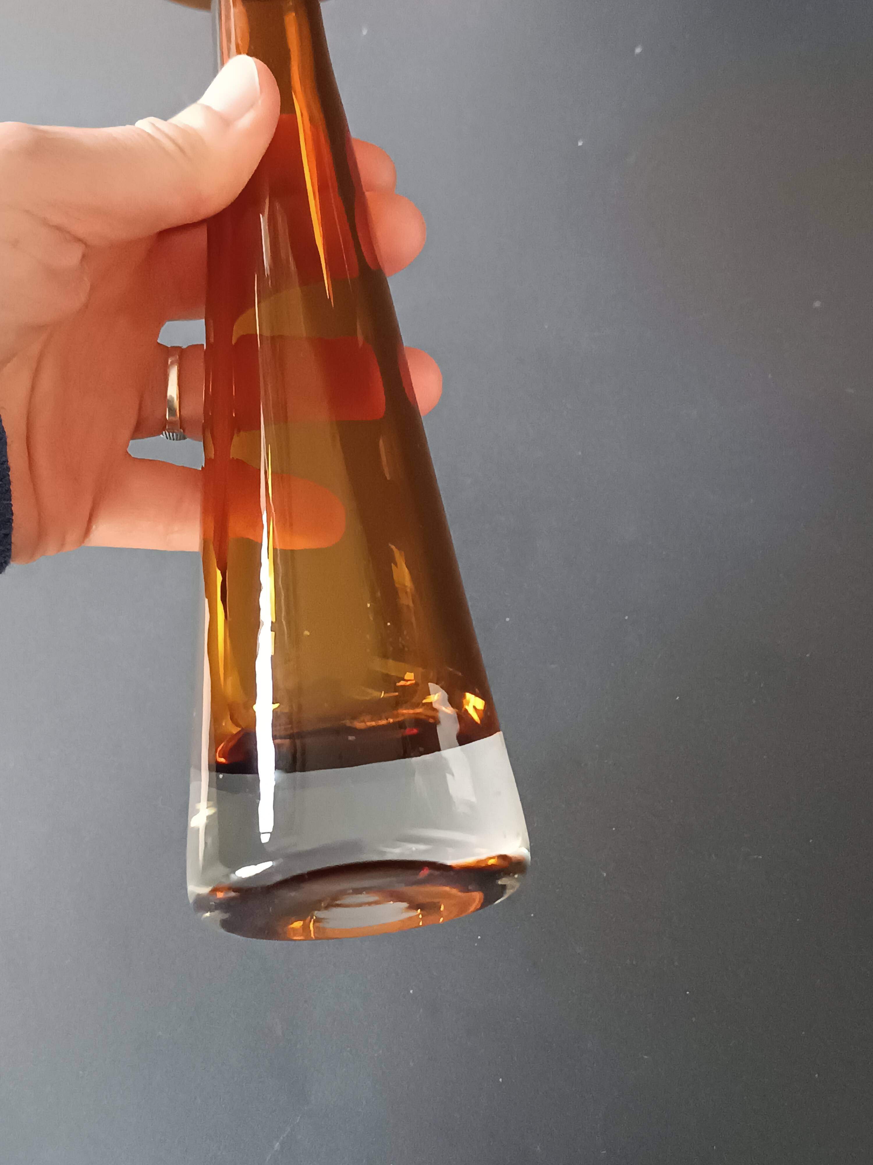 Two vintage Scandinavian double-layered amber blown glass candlesticks