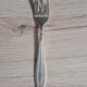 12-piece cutlery set with forks and silver-plated cake server.