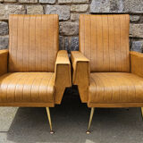 Pair of mustard skaï armchairs, brass feet