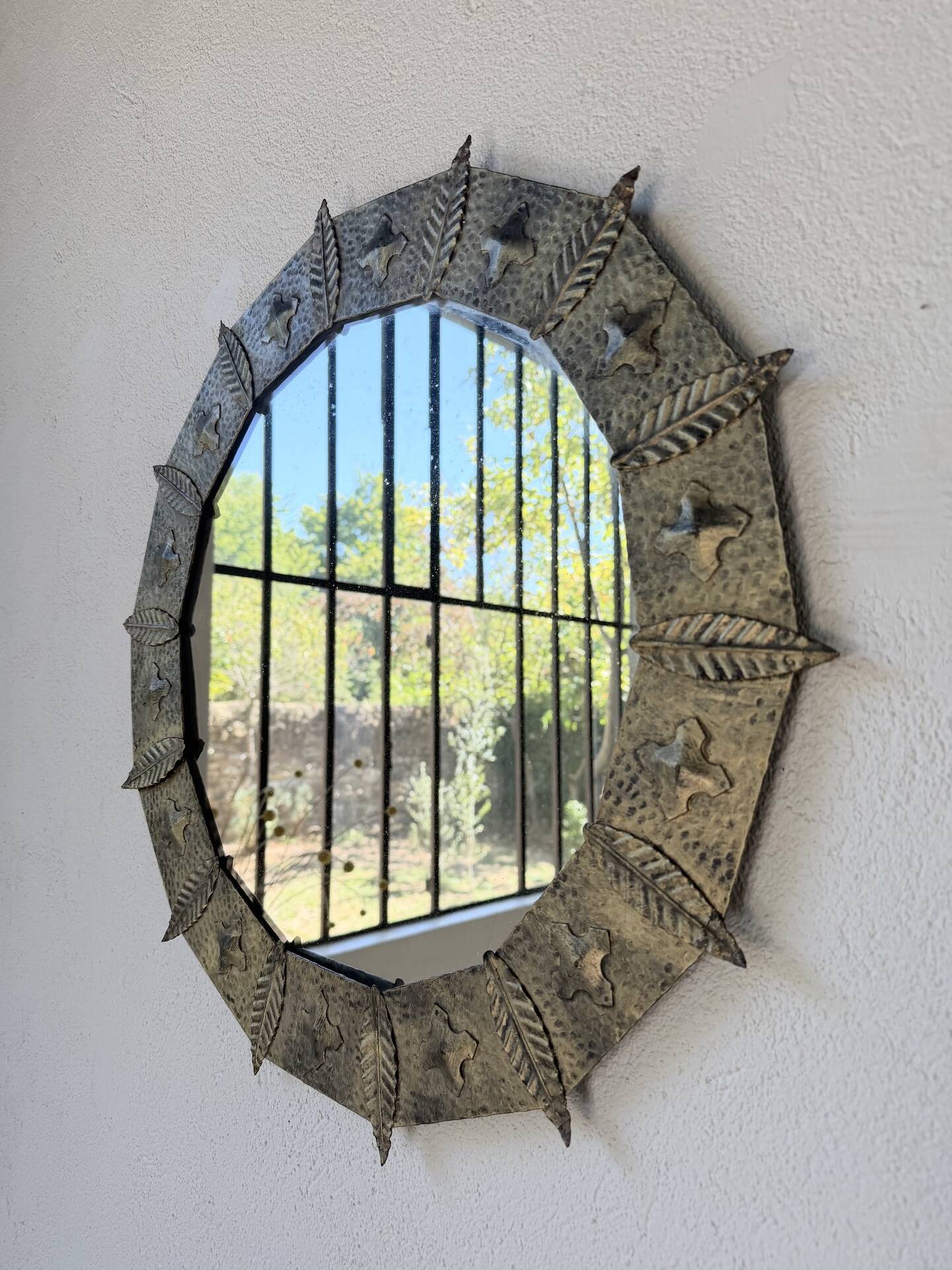 Brutalist round hammered gold metal mirror