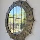Brutalist round hammered gold metal mirror