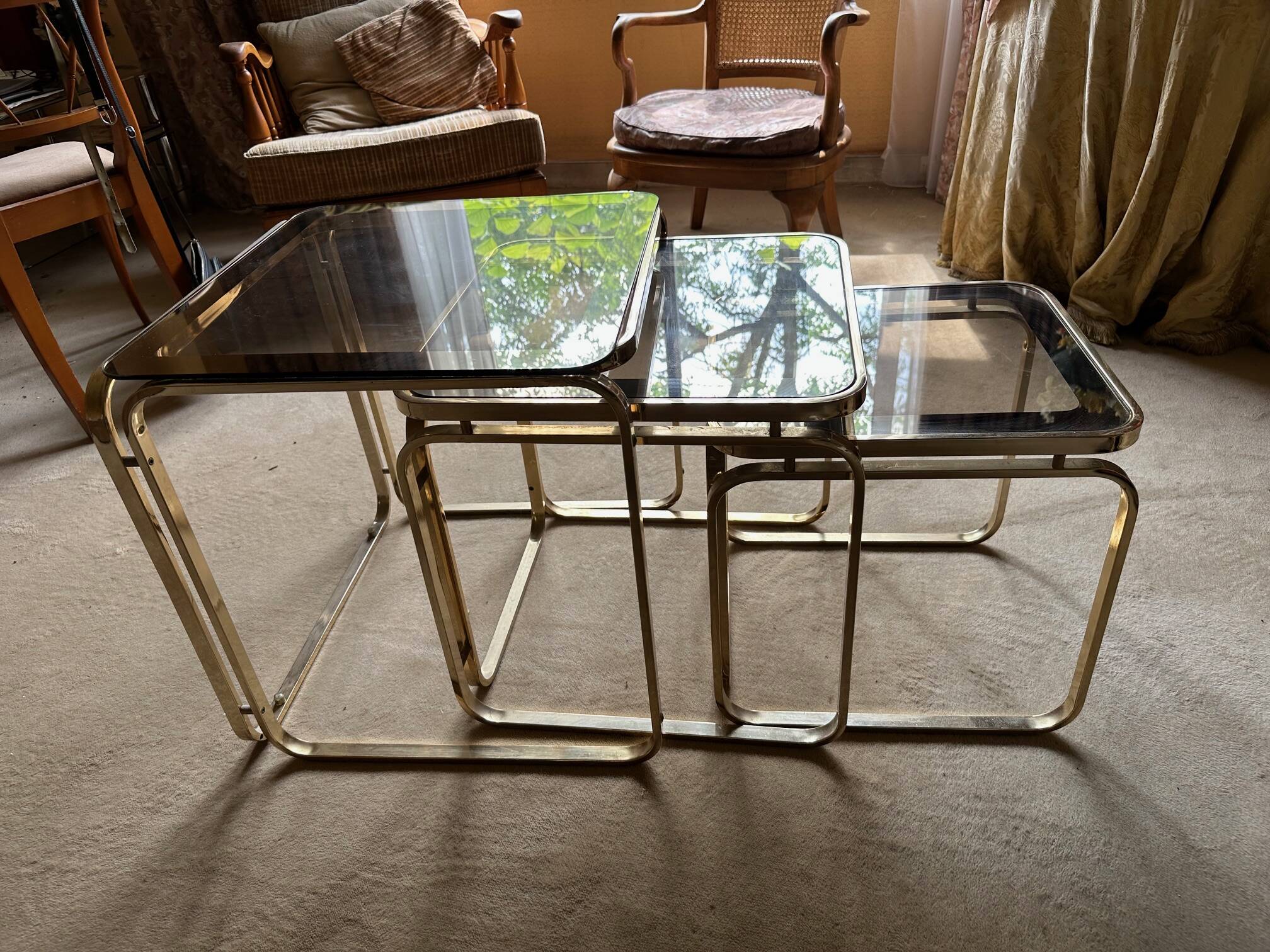 Brass nesting tables with smoked glass tops