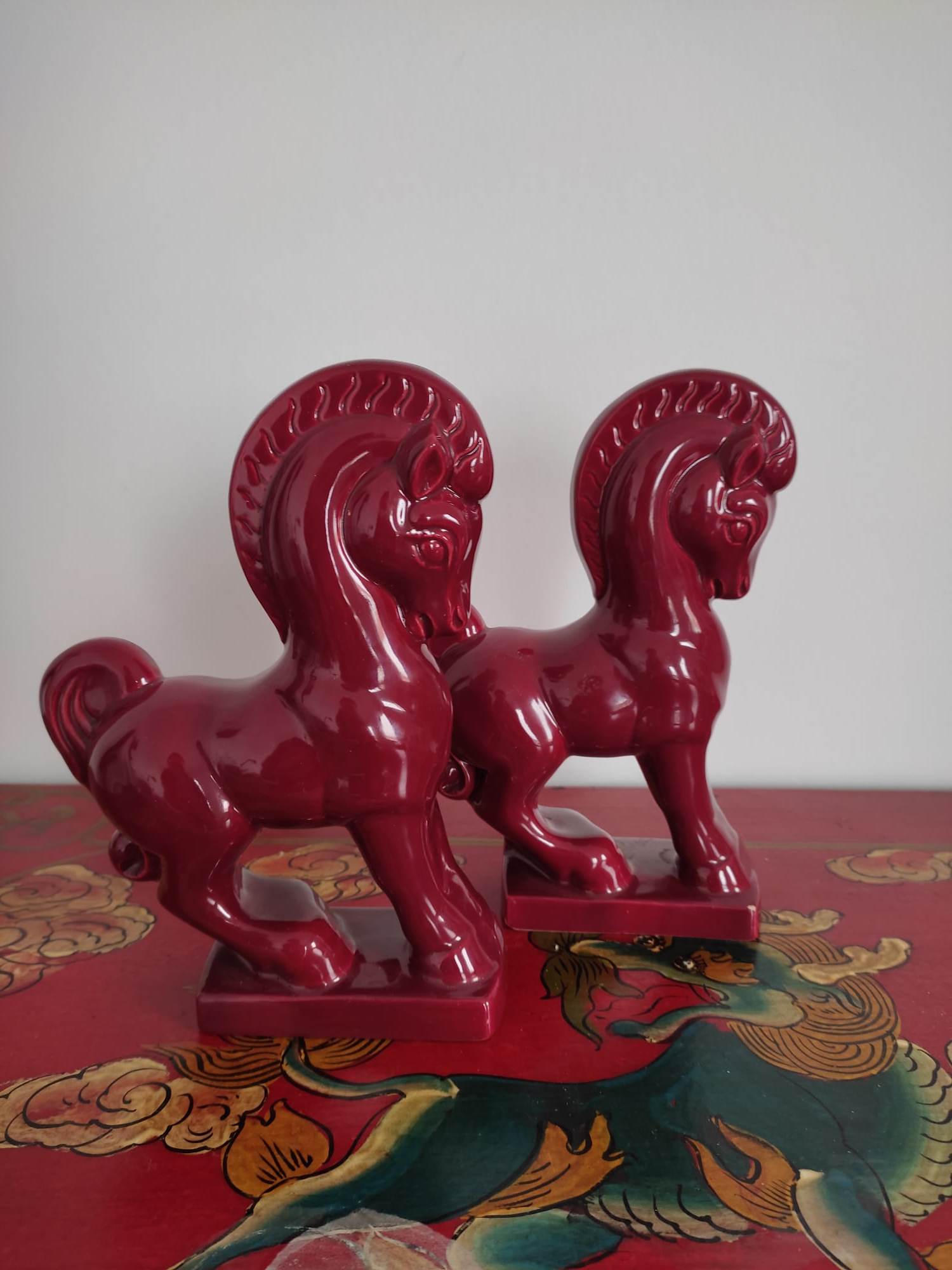 Pair of red porcelain horse bookends