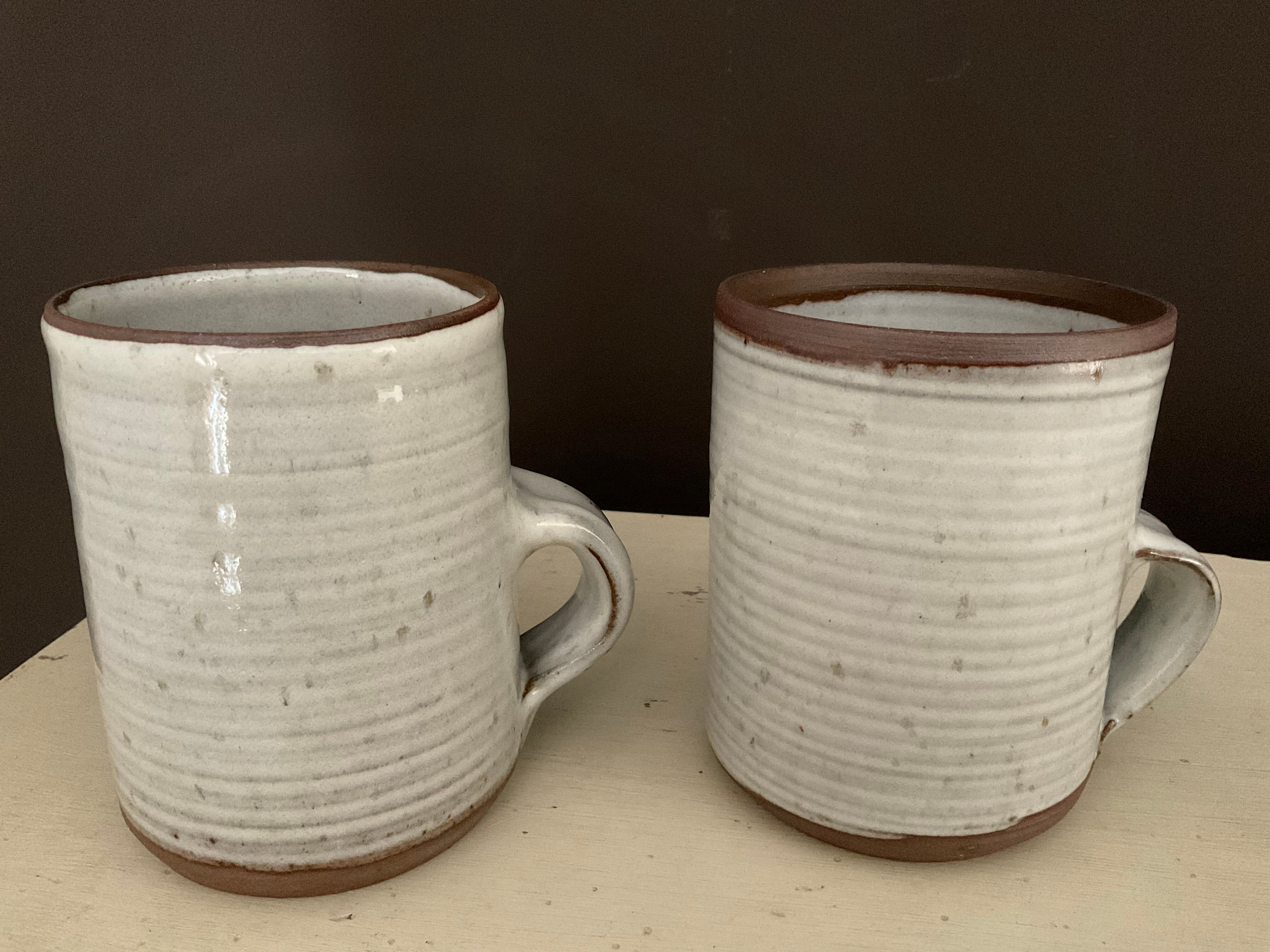 2 Mugs in Sandstone.Roger Jacques St Amand .vintage