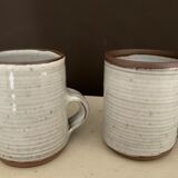2 Mugs in Sandstone.Roger Jacques St Amand .vintage