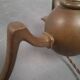 Art and Craft tripod floor lamp in bronze.