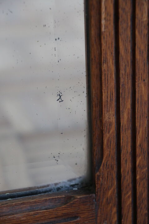 Beveled mirror grooved wood