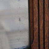 Beveled mirror grooved wood