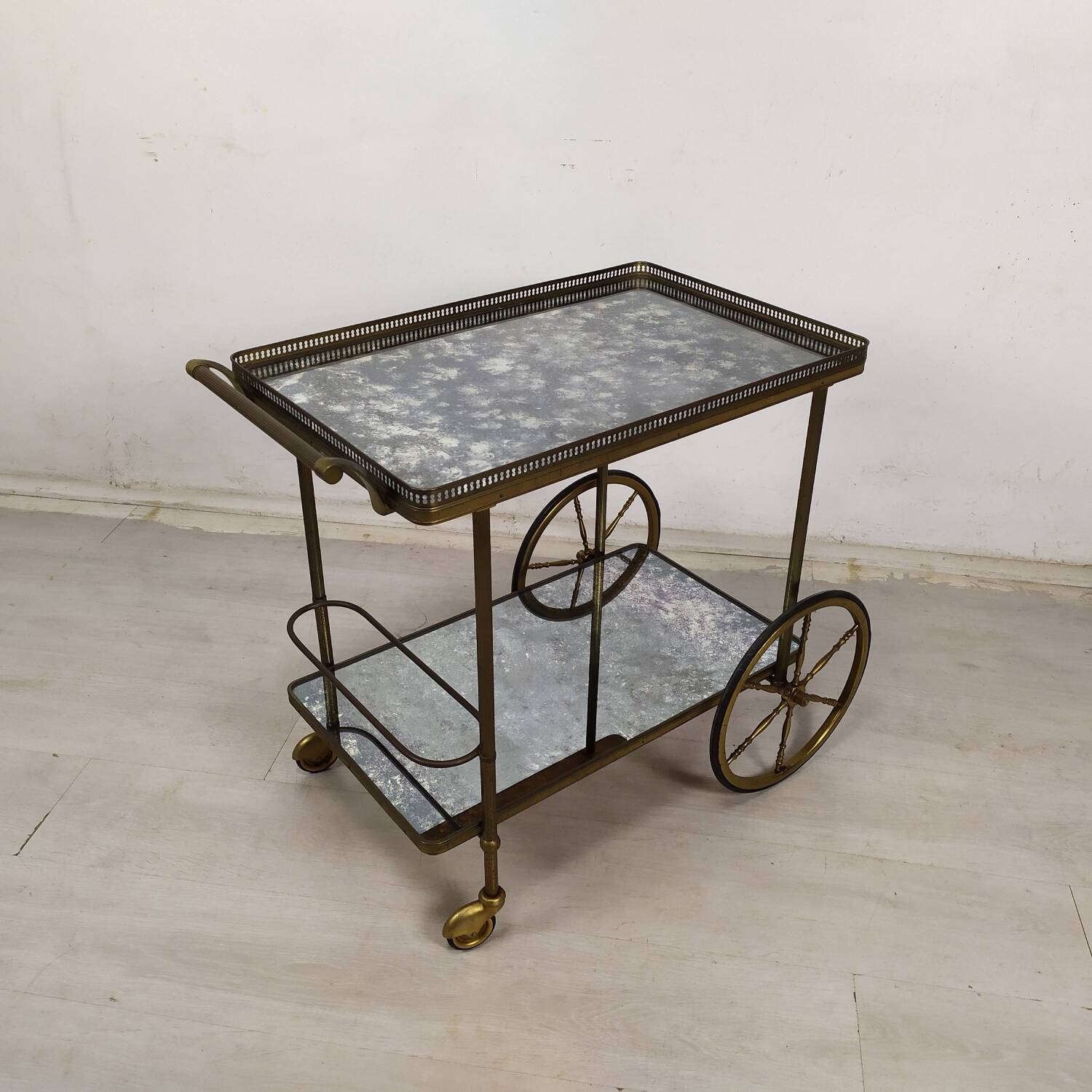 Brass and glass rolling trolley