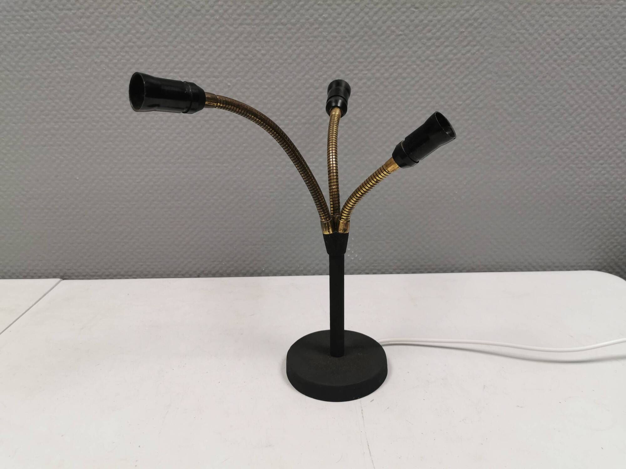 Old cast iron table lamp with brass bend and 3 light sources