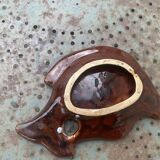 Empty pocket in glazed ceramic slip in the shape of vintage fish