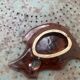 Empty pocket in glazed ceramic slip in the shape of vintage fish