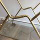 Italian designer rolling table in brass and engraved glass