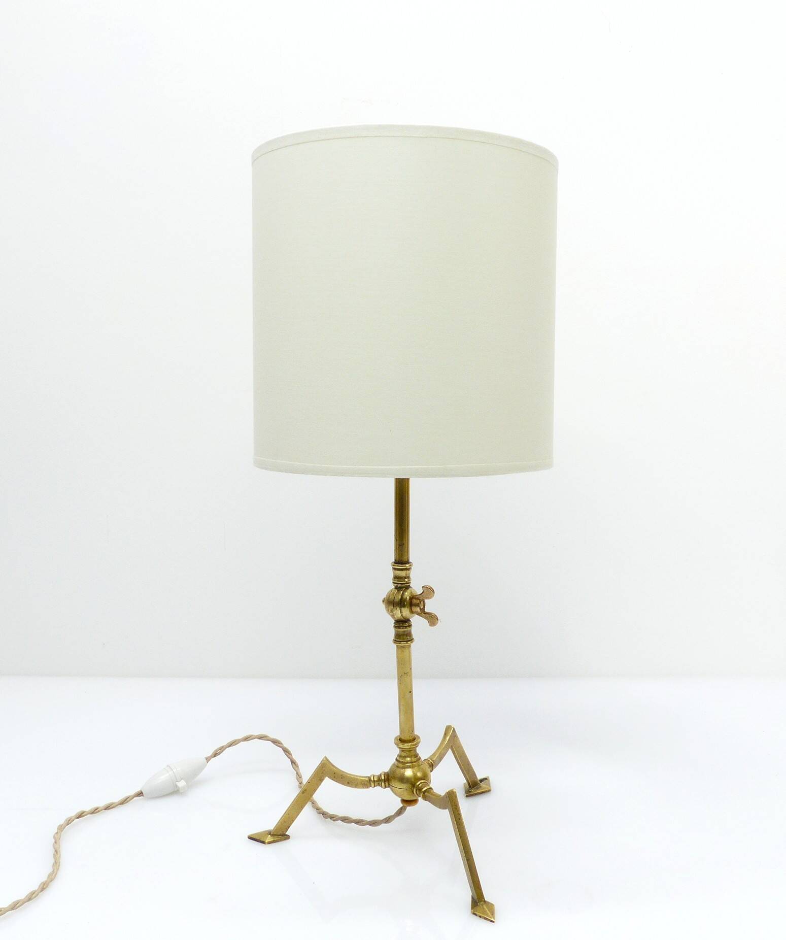 Articulated tripod lamp base in brass, Arts & Crafts style, in the manner of.
