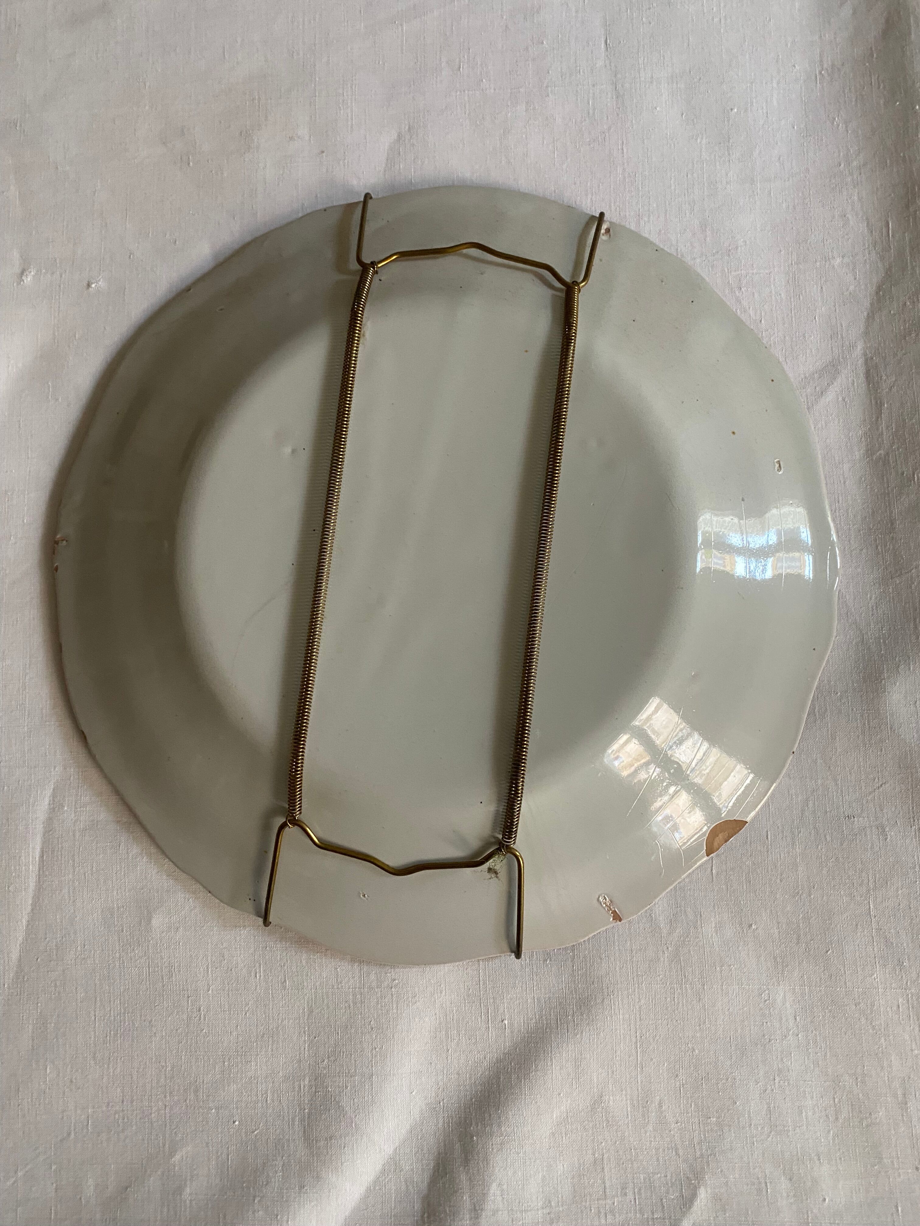 Plate of Nevers in earthenware late eighteenth century decoration of Chinese with pipe