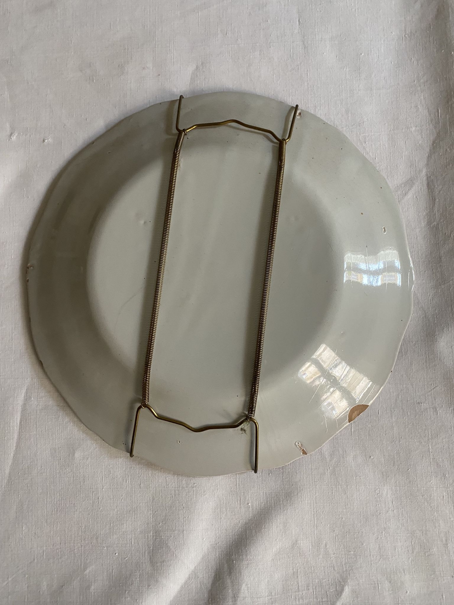 Plate of Nevers in earthenware late eighteenth century decoration of Chinese with pipe