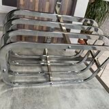 Coffee table with chrome base and mirrored glass top, vintage solar flare decor