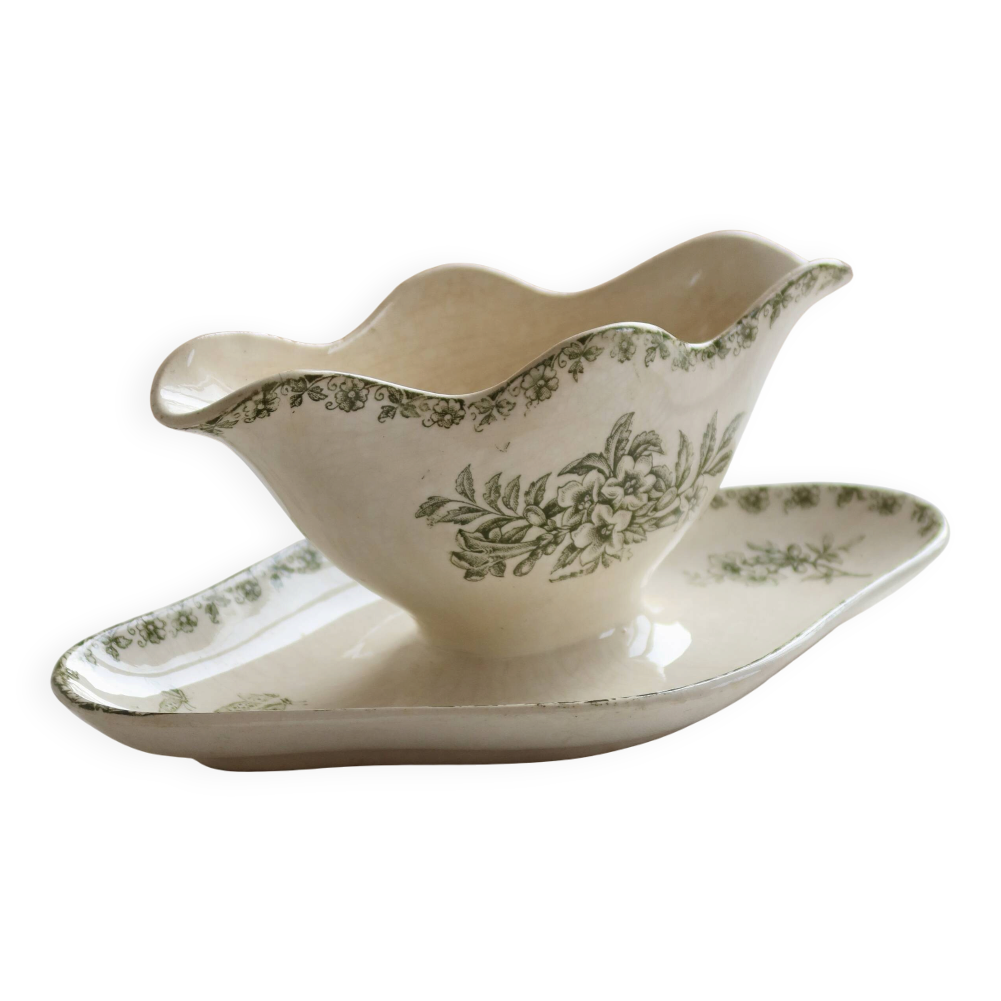 Antique sauce boat, ironstone, ivory with green floral and butterfly decoration.