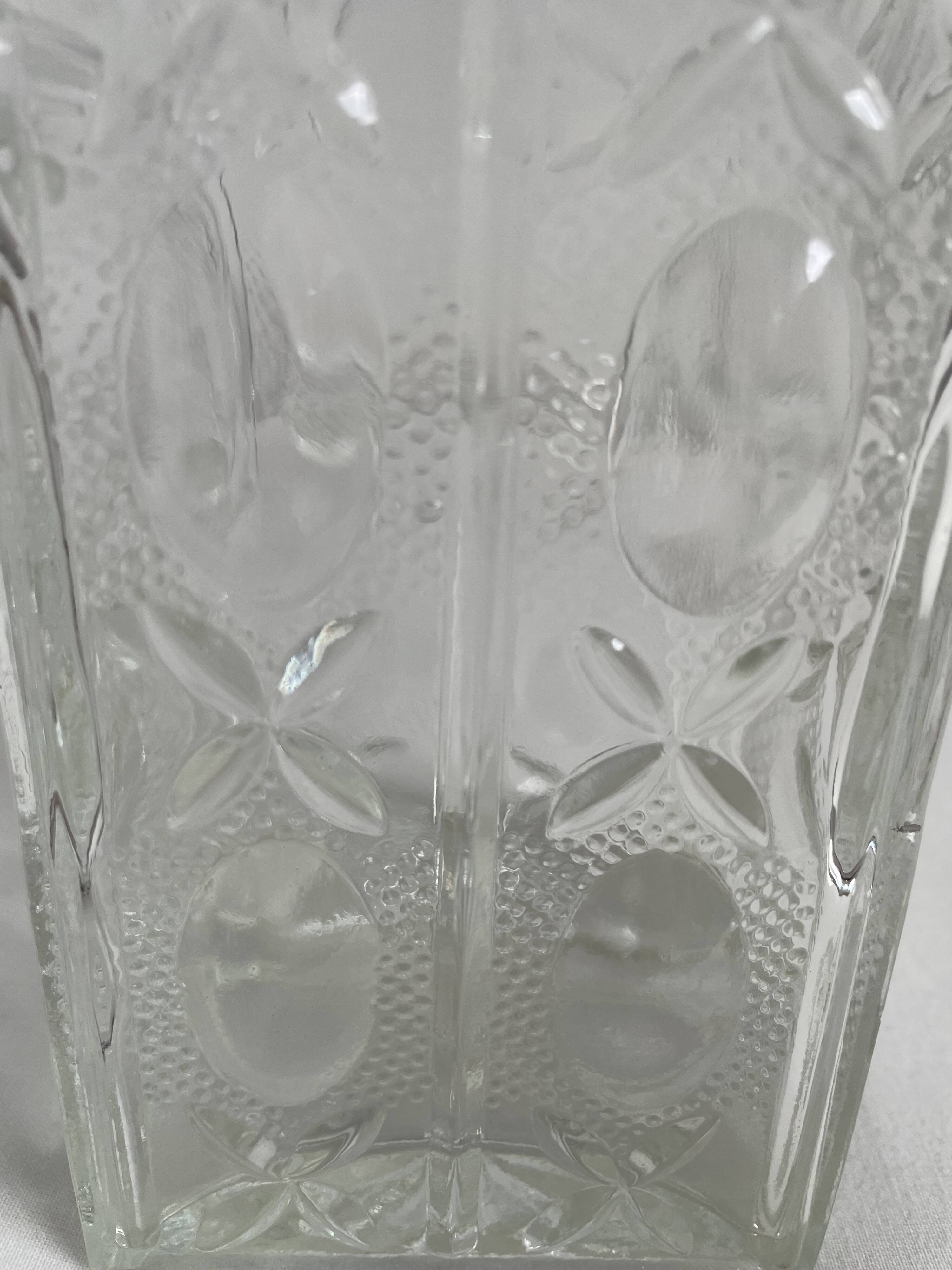 Molded glass carafe, 1960s-1970s, stylized flower decoration, oval, square base, stopper, rosette