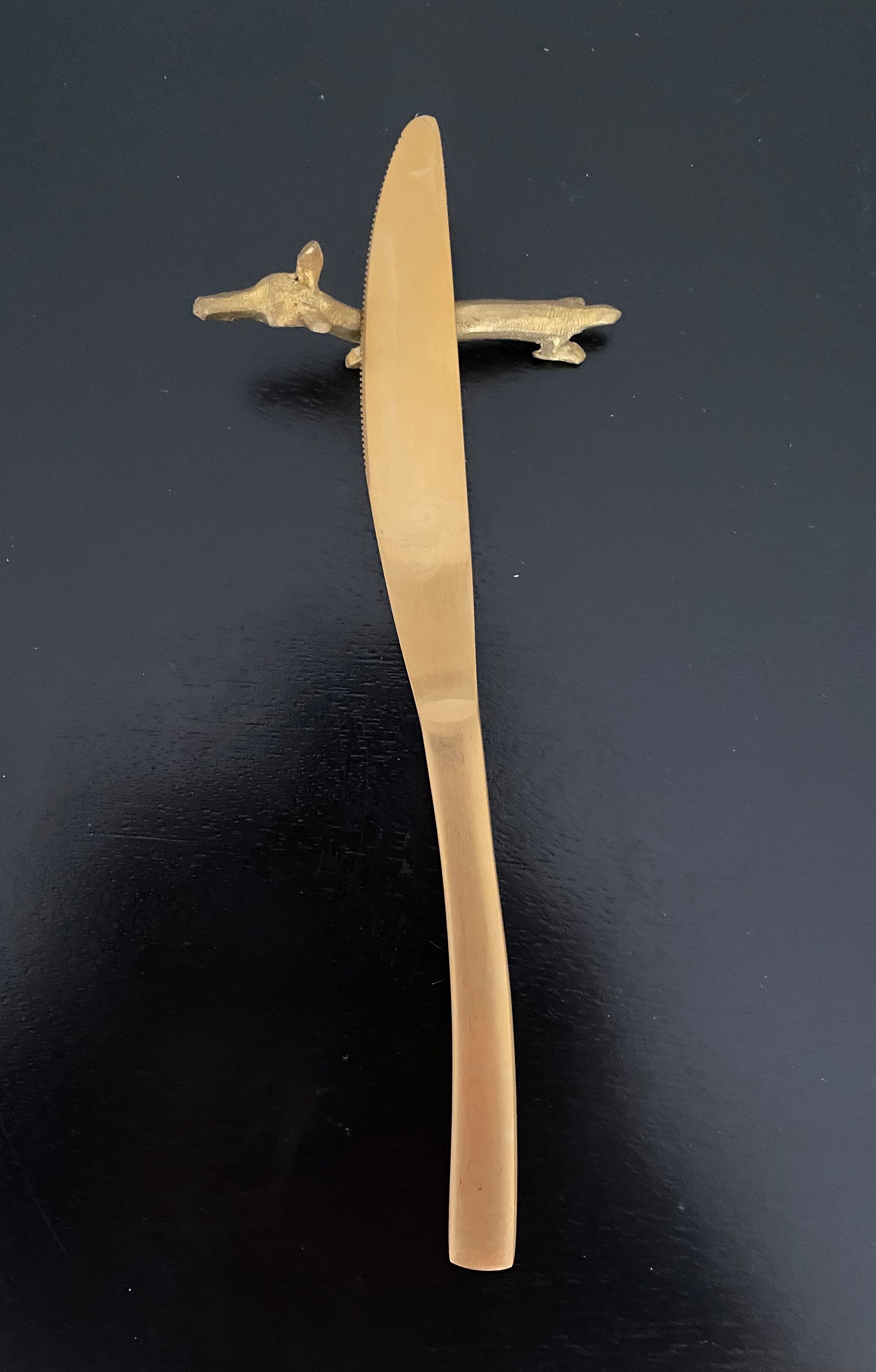 6 brass dromedary-shaped knife holders