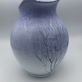 Blue glazed terracotta pitcher with hand-painted decoration, signed