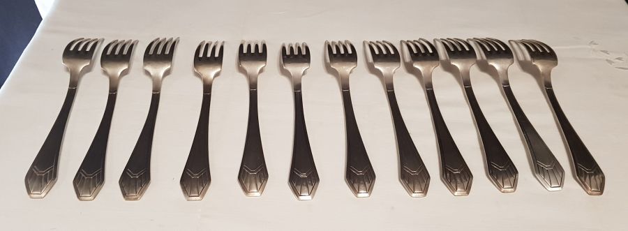 23-piece silver metal art deco cutlery set