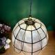 Vintage pendant light in mother-of-pearl and brass.