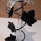 Glass soliflore vase in the shape of a fleur-de-lis on metal base