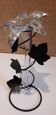 Glass soliflore vase in the shape of a fleur-de-lis on metal base
