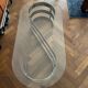 70s oval design coffee table in glass with chrome S legs.