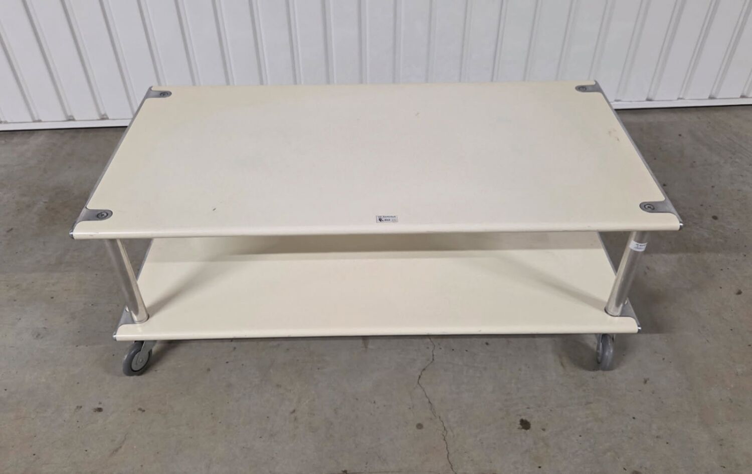 Vintage steel coffee table from the 1970s on wheels.