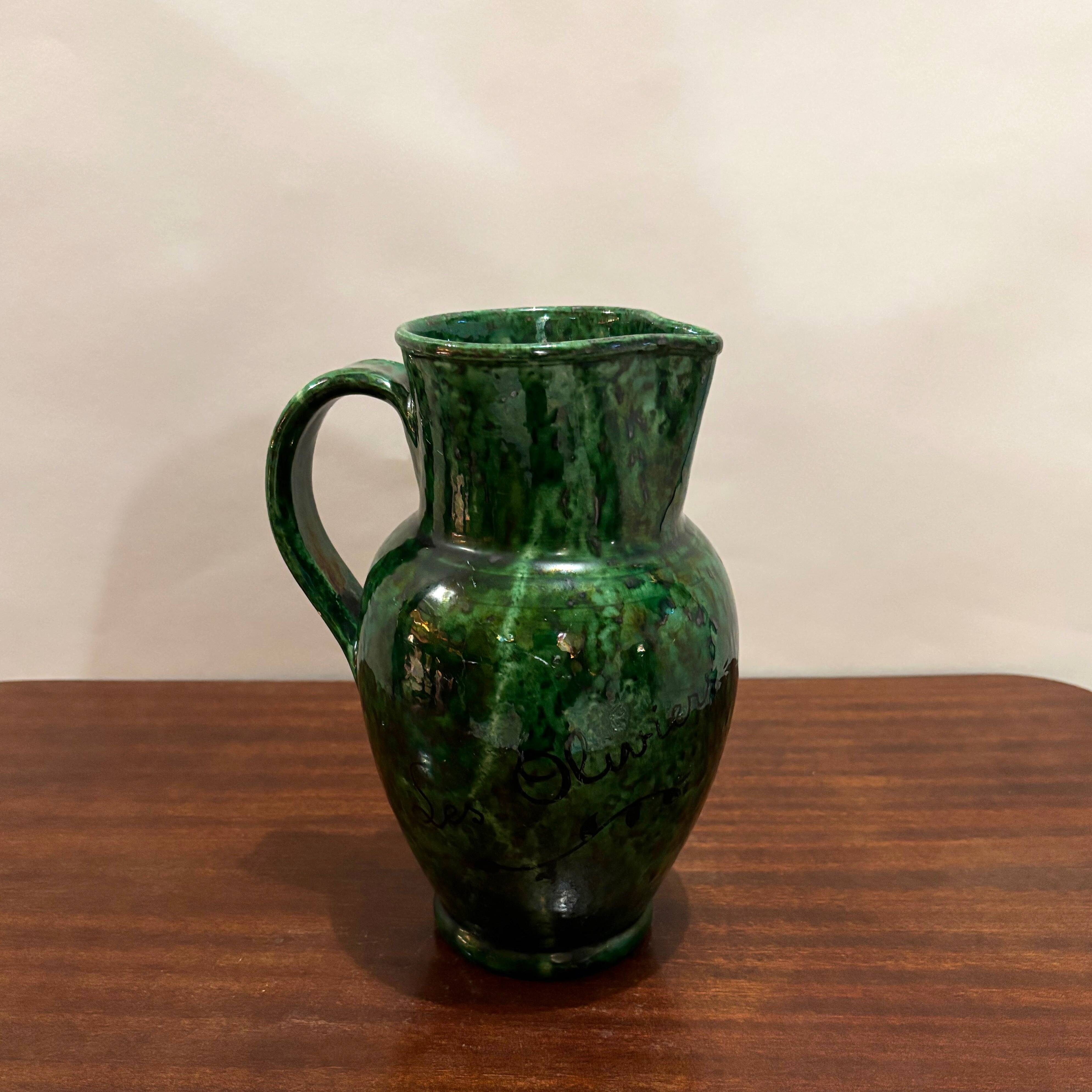 Green glazed ceramic pitcher
