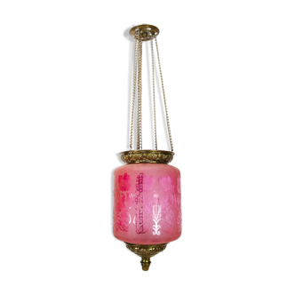 Antique pendant of pink opaline glass with brass edge and suspension from around 1860