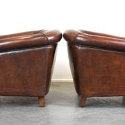 Set of two rugged sheep let of two rugged sheep leather club armchairs with a nice distressed look