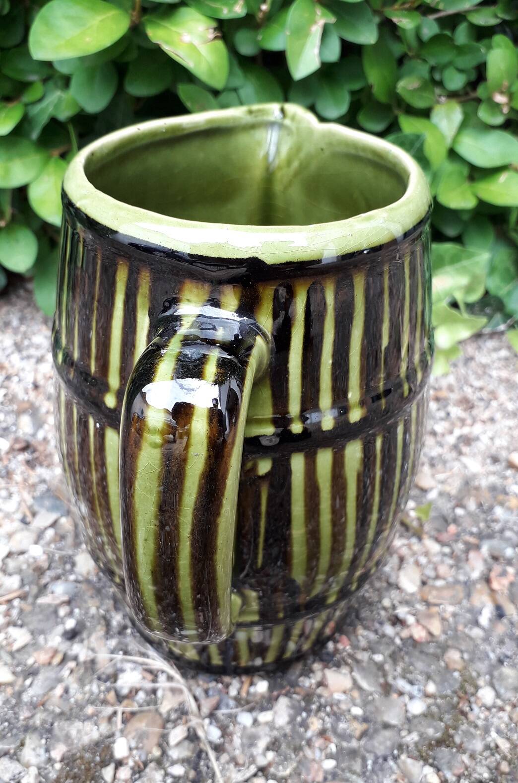 Green and brown ceramic jug