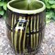 Green and brown ceramic jug