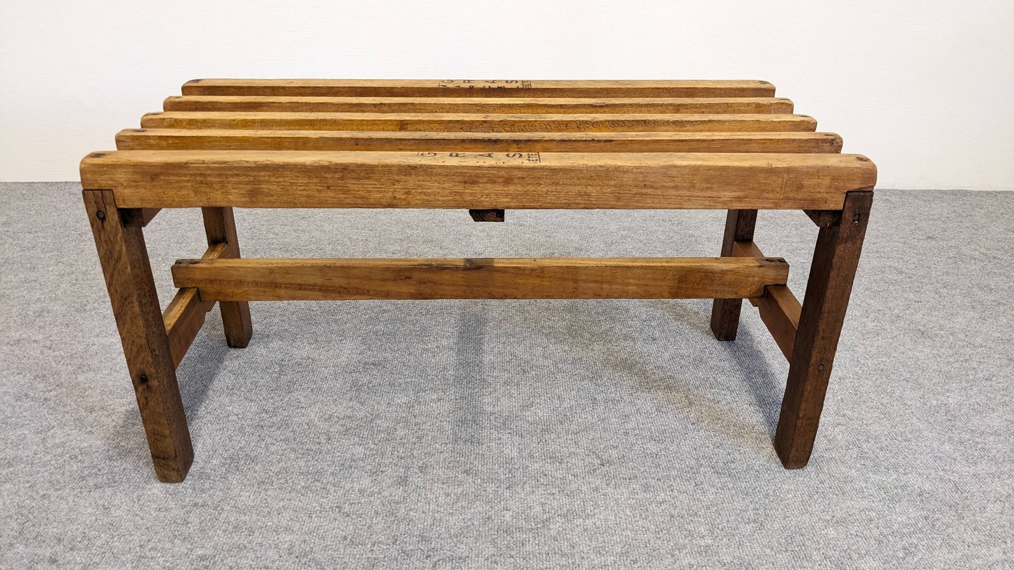 Wooden slatted display bench or support, France circa 1960.