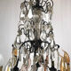 Black lacquered metal chandelier and crystal tassels