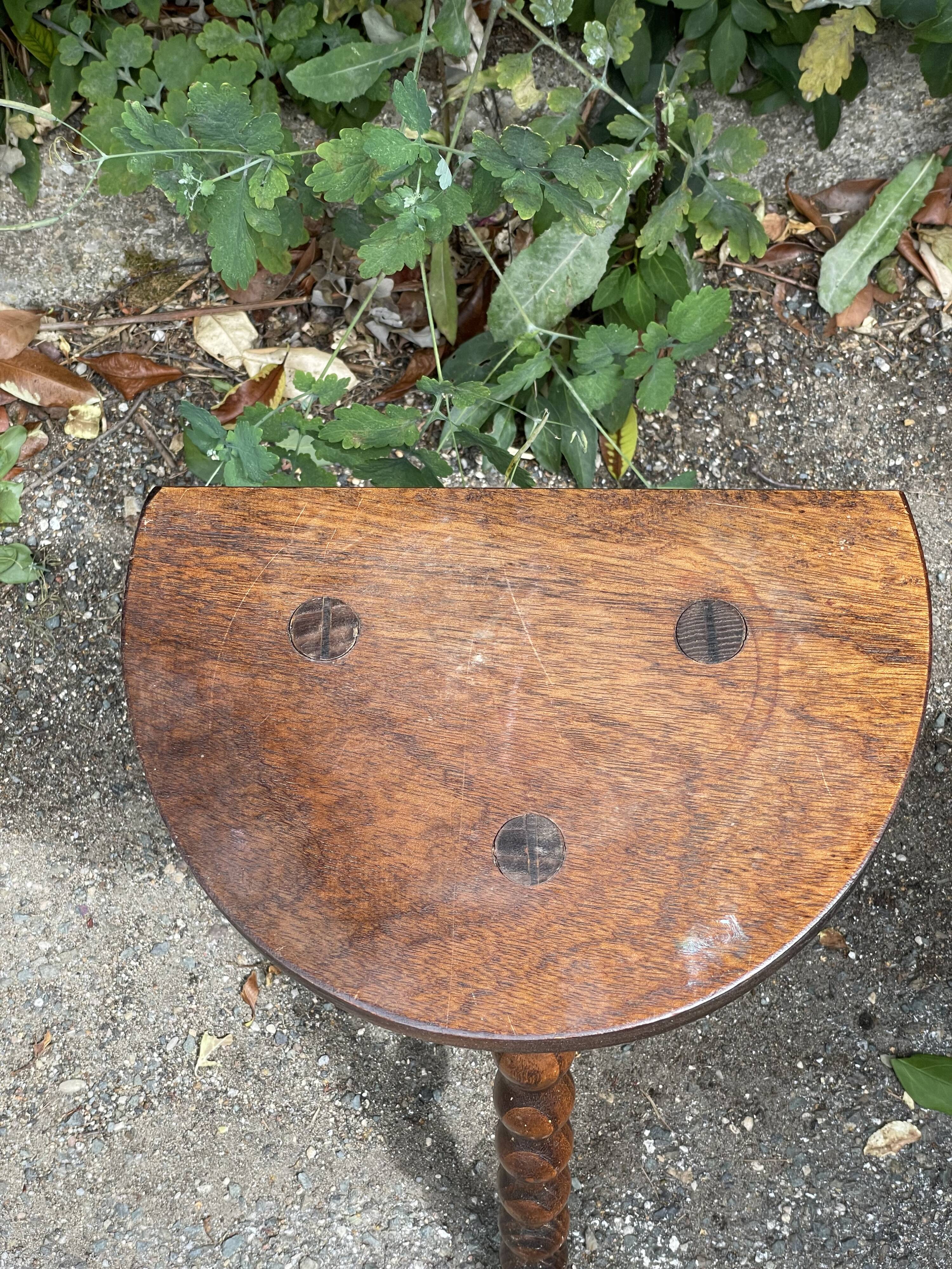 Wooden tripod stool
