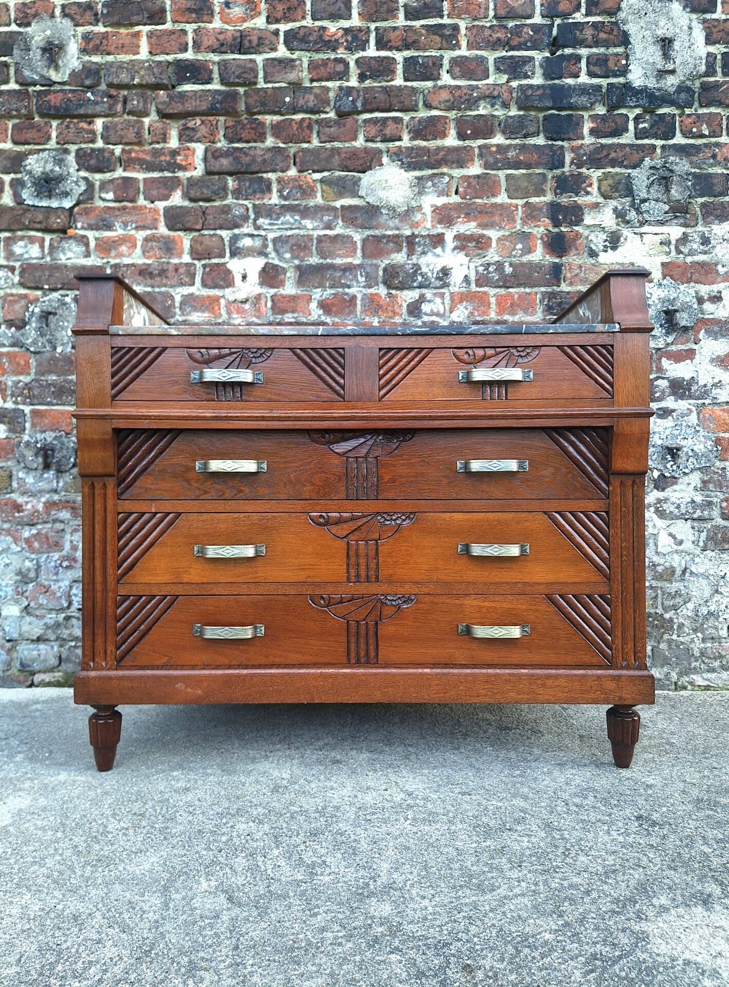 Art Deco commode with marble top, vintage antique furniture.
